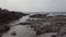 Suggestive view of rocky bay with clean water and natural pools among the rocks