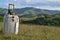 Suitcase with Binoculars and Sunglasses on Meadow