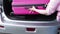 Suitcase in car, Travel concept, woman putting suitcase in car trunk