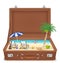 Suitcase open with sea and beach scene in side