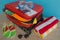 Suitcase with things for spending summer vacation things prepared for travel. Suitcase with different things