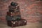 Suitcases against brick wall in vintage style