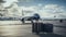 Suitcases with an Airplane standing at the airport. Modern aircraft waiting for traveler luggage to be loaded. Suitcases standing