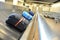 Suitcases on a transportation belt at the airport