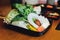 Sukiyaki vegetables set including cabbage, false pak choi, carrot, shiitake, enokitake, tofu, pumpkin, scallion and konjac noodle.