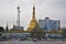 Sule Pagoda with a large Burmese stupa and tall antenna structure