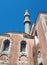 Suleiman mosque in rhodes old town with tall minaret against a blue sunlit sky