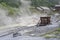 Sulphurous mountain valley with hot spring stream and steam at Tamagawa Onsen Hot spring in Senboku city, Akita prefecture, Tohoku