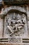 Sulpture Lakshmi sitting in the lap of Vishnu. Kedareshwara Temple, Halebid, Karnataka North Wall.