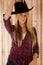 Sultry blond model wearing a cowboy hat barnwood b