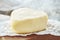 Suluguni cheese is a traditional cheese of the Caucasus. A piece of cheese in the shape of a heart. Suluguni is home-made