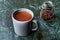 Sumac water or tea and dried ground red Sumac spices with cloves in glass