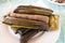 Suman is a Philippine favorite made of sticky rice in banana and cooked in coconut milk