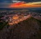 Sumeg, Hungary - Aerial view of the famous illuminated High Castle of Sumeg in Veszprem county at sunset with colorful clouds