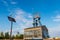 Summary of new and old technologies of energy production. Street lamp with a photovoltaic panel, a windmill and an old mine shaft