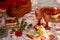 Summer aesthetic pink picnic with tablecloth marshmallows, macaroons, peas, strawberries, glasses of wine, cherries