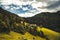 Summer alpine countryside landscape with high mountains and farms in the forest glade. Logar valley Logarska Dolina from the pan