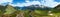 Summer Alps mountain pass panorama.