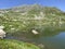 Summer atmosphere on the Lago dei Morti or Lake of the Dead Totensee in the Swiss alpine area of mountain St. Gotthard Pass