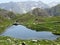 Summer atmosphere on the Lago dei Morti or Lake of the Dead Totensee in the Swiss alpine area of mountain St. Gotthard Pass