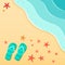 Summer background with flip flops on a sea beach with starfish shells.