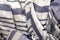Summer background of open weave blue and white striped fabric with tassels - scrunched with selective focus