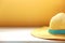 Summer background.Yellow beach hat on wooden table empty space backdrop.Hello summer concept
