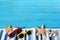 Summer beach border, starfish, sunglasses, blue wood, copy space