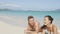 Summer beach couple on honeymoon relaxing happy