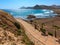 Summer beach, footpath and palm trees Spain.