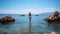 Summer Beach Getaway, Woman Standing on a Sea Rock for Relaxation and Enjoyment