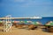 Summer beach near the sea - trestle beds, umbrellas for shade, l