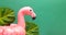 Summer beach party concept. Pink flamingo, tropical leaf monstera and orchid flowers on green background. Flat lay, copy space
