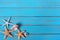 Summer beach seashore background starfish blue old wood paint peeeling