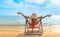 Summer beach vacation concept, Asia woman with hat relaxing and arm up on chair beach at Koh Mak, Trad, Thailand