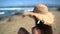 Summer beach vacation panoramic young woman with straw hat on Caribbean getaway