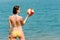 Summer beach woman enjoy sun hold ball