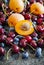 Summer berries and fruits: sweet cherries, blueberries and apricots
