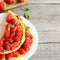 Summer berry omelette. Colorful easy omelette stuffed with fresh strawberries and garnished with mint on a plate