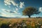 Summer bliss Expansive flower field with majestic tree against blue sky