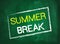 Summer break text on green blackboard