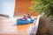 In the summer, on a bright sunny day, in a water park, a brother and sister ride off a slide on an air mattress