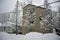 Summer cabins resting under a fresh snow fall