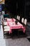 Summer cafe tables with checkered tablecloths.