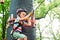 Summer camp. Cute boy in an adventure rope park