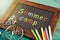 Summer camp written with crayons on chalkboard