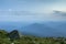 Summer camping in mountains at dawn. Tourist tent on round grass