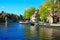 Summer canal with barges in summer in Amsterdam