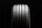 summer car tire tread, front view, black background