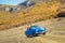 Summer car travel freedom woman in Yosemite National Park with arms raised up cheerful and happy. Summer road trip